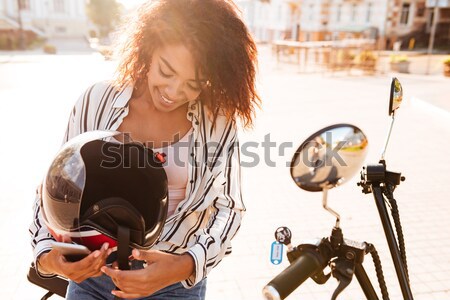 Sorridente mulher óculos de sol moderno motocicleta Foto stock © deandrobot