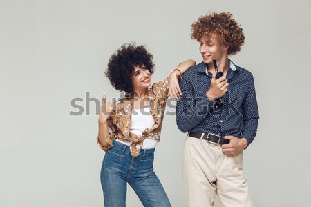 Serious retro loving couple standing isolated Stock photo © deandrobot