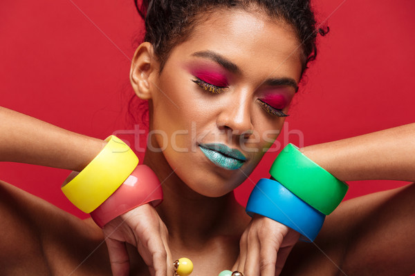 Closeup image of young mulatto woman being bright and stylish ge Stock photo © deandrobot