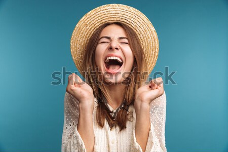 Close up portrait of happy cheerful girl in winter hat Stock photo © deandrobot