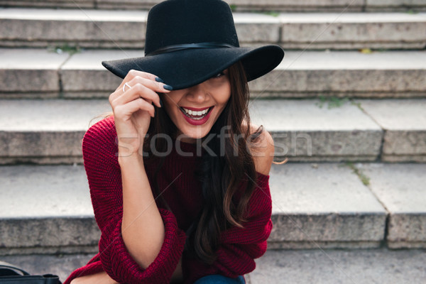 Close up portrait of a cheerful attractive asian woman Stock photo © deandrobot