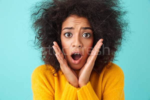 Image closeup of emotional woman grabbing her face and reacting  Stock photo © deandrobot
