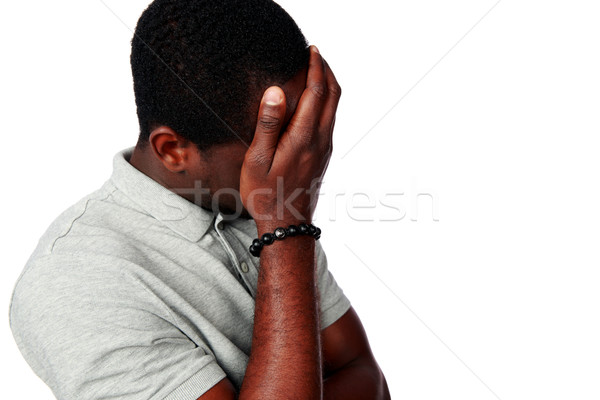 Portré zaklatott afrikai férfi izolált fehér Stock fotó © deandrobot