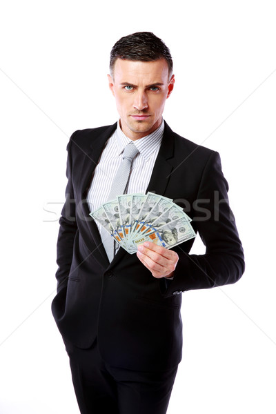 Confident businessman holding US dollars isolated on a white background Stock photo © deandrobot