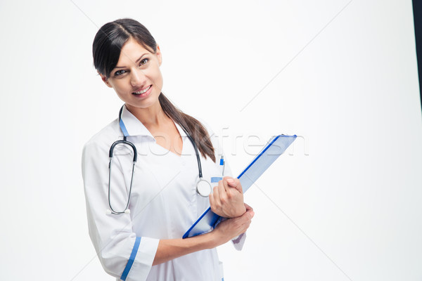 Medical doctor holding clipboard Stock photo © deandrobot