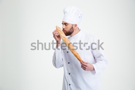 Male chef cook smelling fresh bread  Stock photo © deandrobot