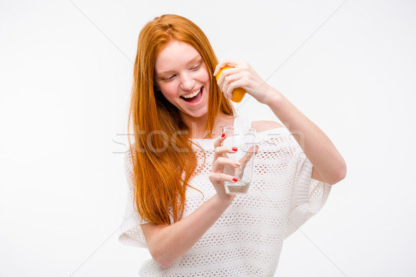Emotionat femeie suc de portocale sticlă mână zâmbitor Imagine de stoc © deandrobot