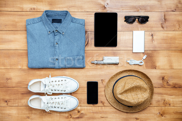 Travel concept shoes, shirt, mobile phone, mp3, usb, eyeglasses, Stock photo © deandrobot