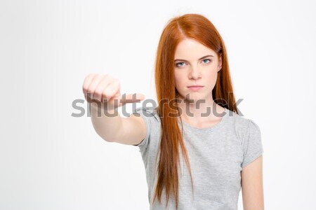 Strict serious young woman showing stop gesture Stock photo © deandrobot