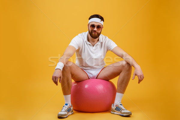 Mosolyog sportoló ül fitnessz labda napszemüveg Stock fotó © deandrobot