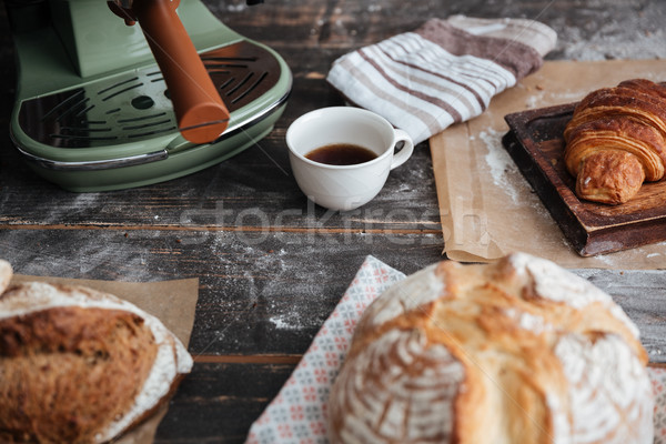 Cropped image of a lot of bread on table Stock photo © deandrobot