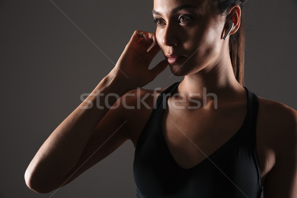 Close up portrait of a young fitness woman Stock photo © deandrobot