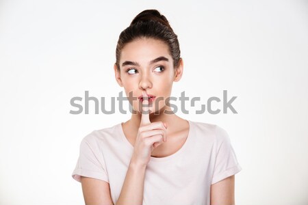 Portrait of beautiful pensive young woman with perfect skin hold Stock photo © deandrobot