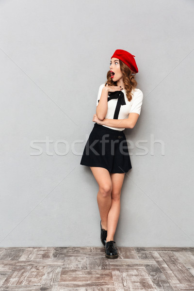 Full length portrait of an astonished schoolgirl Stock photo © deandrobot