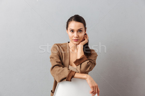 Portrait of a confident young asian woman Stock photo © deandrobot