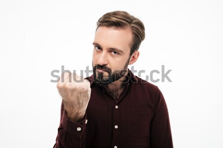 Portrait of an angry furious man threatening with a fist Stock photo © deandrobot