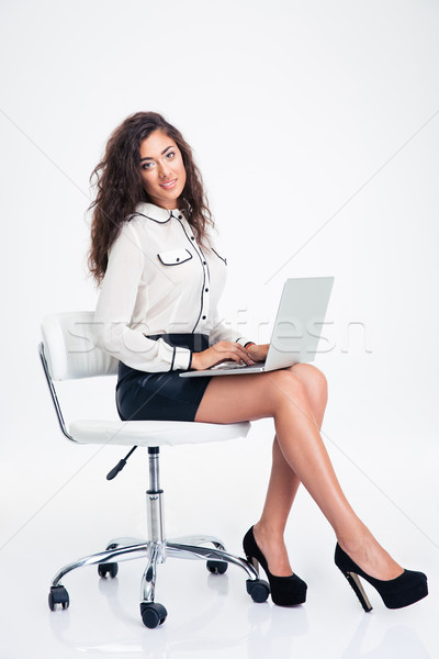 Imprenditrice seduta sedia da ufficio laptop felice giovani Foto d'archivio © deandrobot