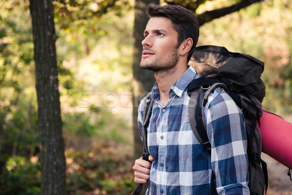 Handsome man traveling in the forest  Stock photo © deandrobot