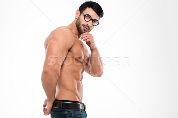 Portrait of a muscular man in glasses Stock photo © deandrobot