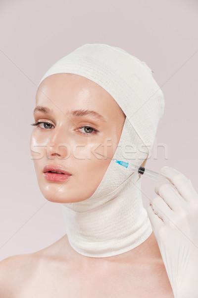 Unusual model and syringe Stock photo © deandrobot