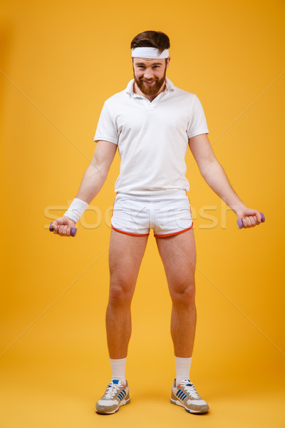Teljes alakos portré sportoló könnyűsúlyú súlyzók pózol Stock fotó © deandrobot