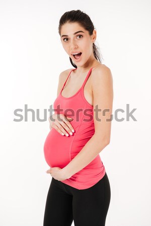Szczęśliwy podniecony młodych kobieta w ciąży brzuch Zdjęcia stock © deandrobot