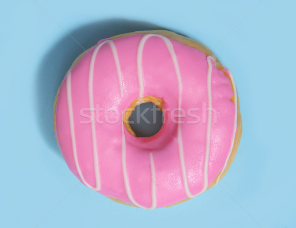 One colorful sweeties donut over blue background. Stock photo © deandrobot
