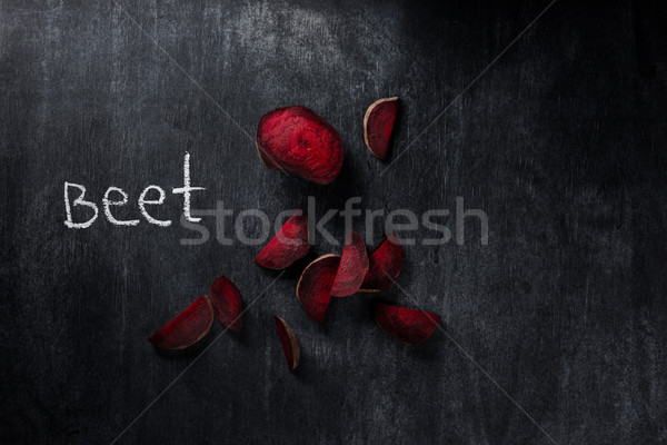 Beet over dark chalkboard background Stock photo © deandrobot