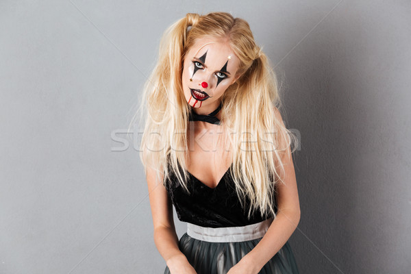 Mystery blonde woman in halloween make up posing in studio Stock photo © deandrobot