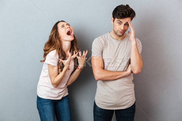 Portrait of a upset young couple having an argument Stock photo © deandrobot