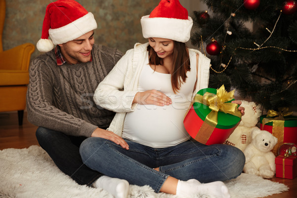 Alegre bastante mujer embarazada marido Navidad Foto stock © deandrobot