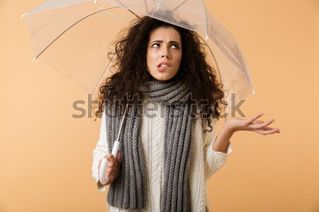 Asian displeased lady showing stop gesture. Stock photo © deandrobot