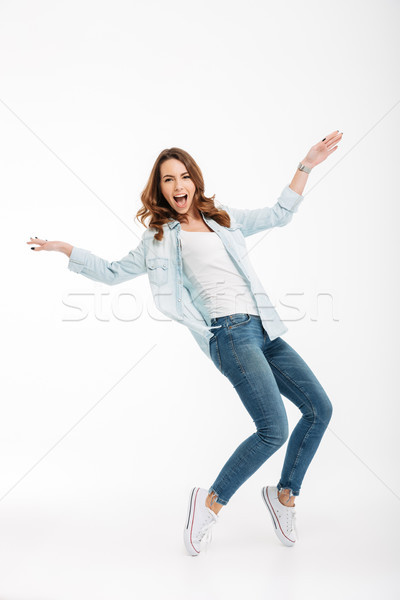 Cheerful beautiful young woman have fun. Stock photo © deandrobot