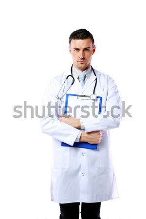Stock photo: Male doctor holding empty clipboard isolated on white background