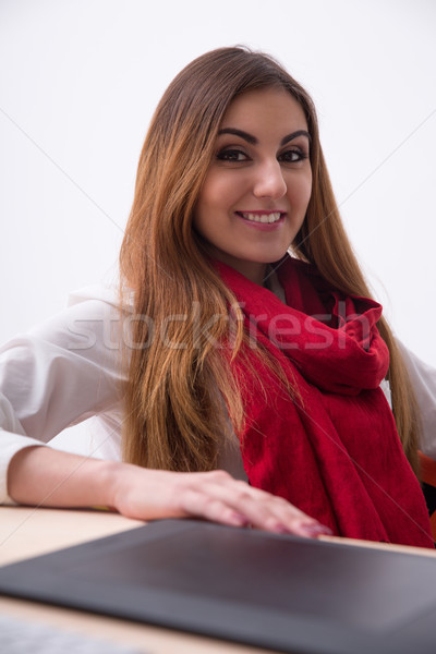 Stock photo: Portrait of a happy young woman sitting at the table