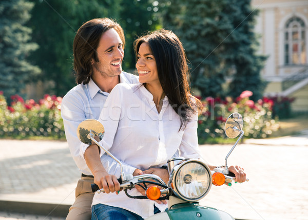 Boldog pár flörtöl moped néz lány Stock fotó © deandrobot