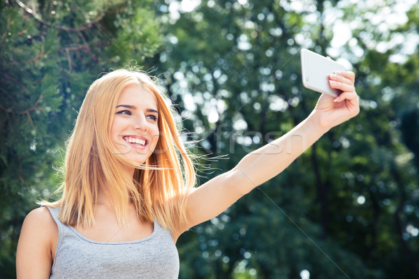 Woman making selfie photo Stock photo © deandrobot