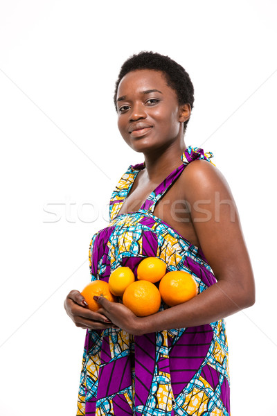 Belo sorridente africano americano mulher em pé Foto stock © deandrobot