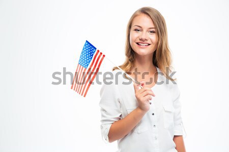Cheerful young businesswoman holding flag of United states Stock photo © deandrobot