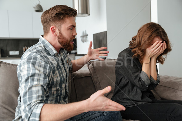 Angry young quarrel loving couple Stock photo © deandrobot