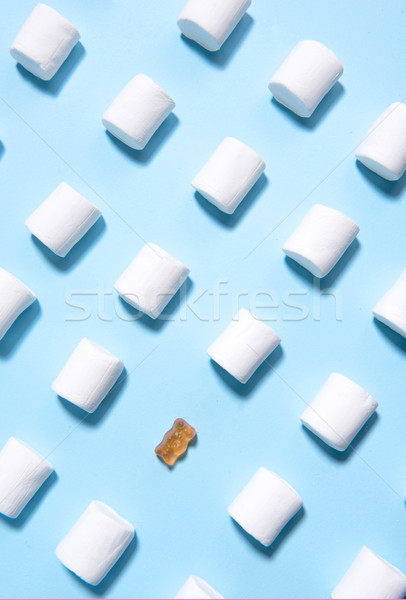 Stock photo: Sweeties marshmallows over blue table background.