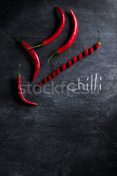 Fotografia cięcia chili pieprz ciemne górę Zdjęcia stock © deandrobot