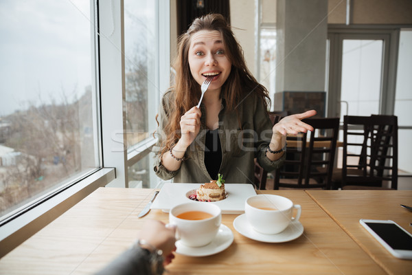 happy woman with cake Stock photo © deandrobot
