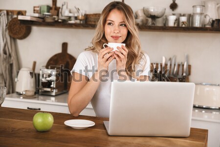 Attractive beautiful redhead young lady sitting in cafe Stock photo © deandrobot