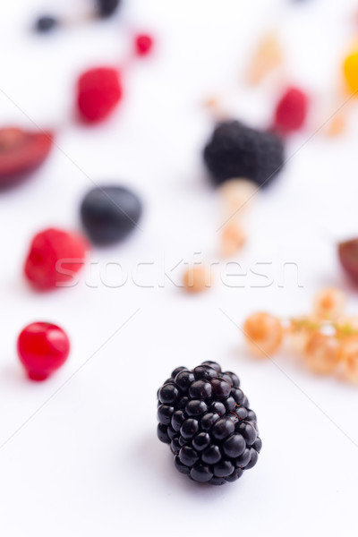 Mix of berries isolated over white background table. Stock photo © deandrobot
