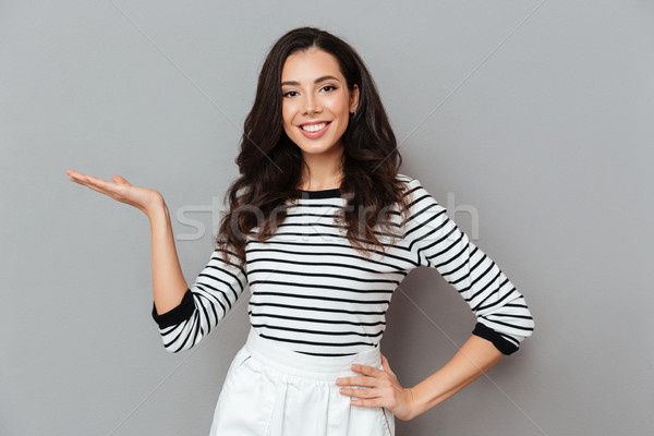 Portrait of a cheerful woman dressed in a skirt Stock photo © deandrobot