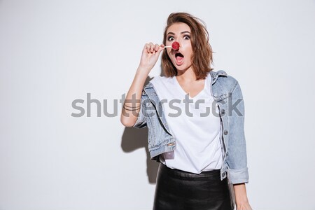 Surprised happy asian business woman screaming and looking away Stock photo © deandrobot
