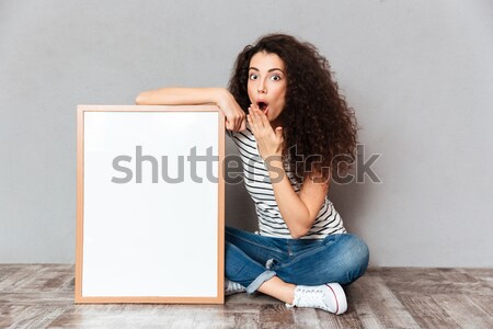 Femme belle cheveux posant jambes croisées [[stock_photo]] © deandrobot