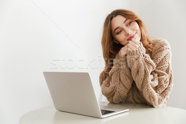 Image of young woman 20s with brooding gaze looking aside and us Stock photo © deandrobot