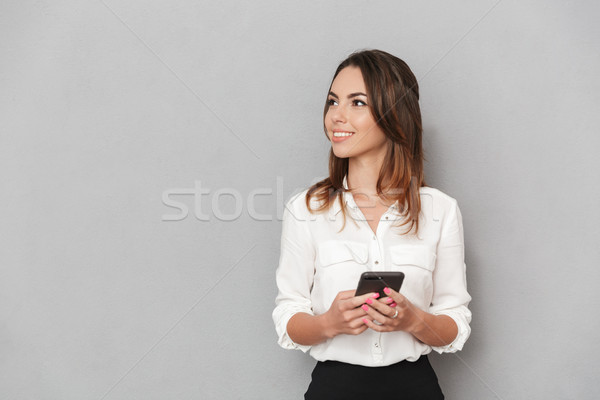 Portrait of a happy young business woman Stock photo © deandrobot